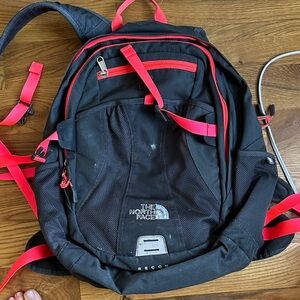 The North Face Black Backpack with Pink straps